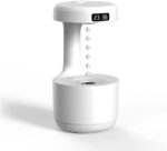 Sleek and modern Anti-Gravity Humidifier with a mesmerizing water drop backflow effect, integrated clock display, and ambient LED lighting—perfect for enhancing any bedroom or office space.